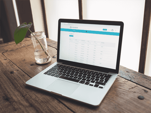 Glass Shop GO billing dashboard on a laptop